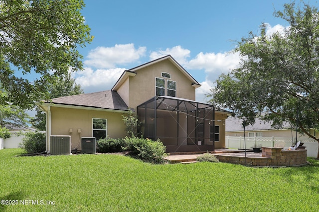 741 W Kings College Dr, Saint Johns, FL 32259 - back of house featuring stucco siding, a patio area, roof with shingles, and glass enclosure