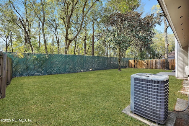 view of yard featuring a fenced backyard and cooling unit