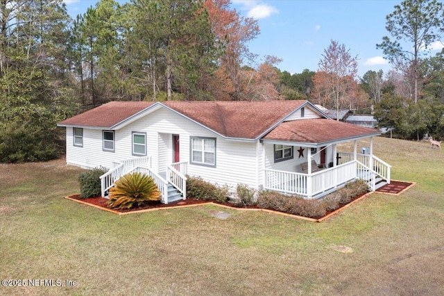 view of front of home featuring covered porch, a front lawn, and a shingled roof