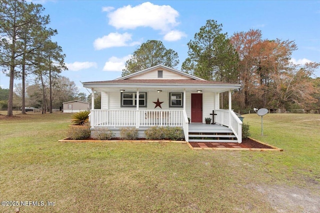 bungalow-style house featuring a porch and a front yard