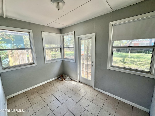 interior space featuring baseboards