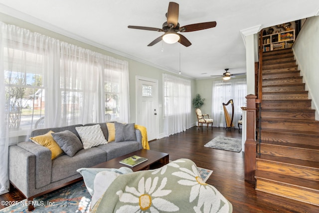 living room with crown molding, stairway, and wood finished floors