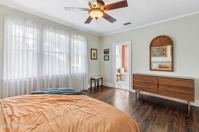 bedroom featuring wood finished floors, a ceiling fan, visible vents, baseboards, and ornamental molding