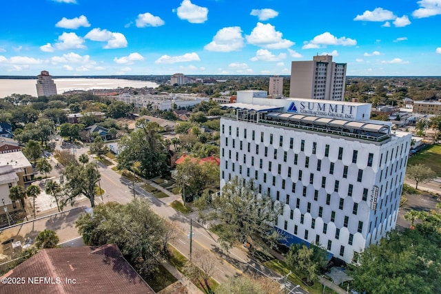 bird's eye view featuring a water view and a city view