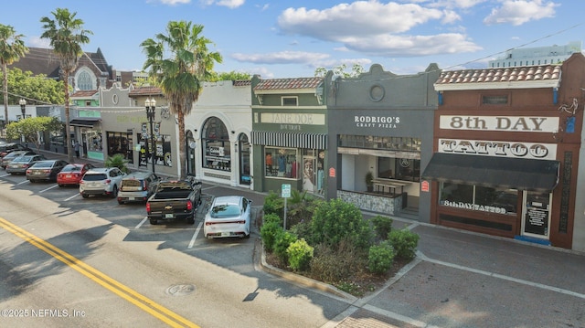 view of building exterior featuring uncovered parking