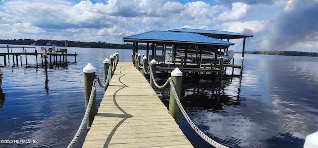 dock area featuring a water view and boat lift