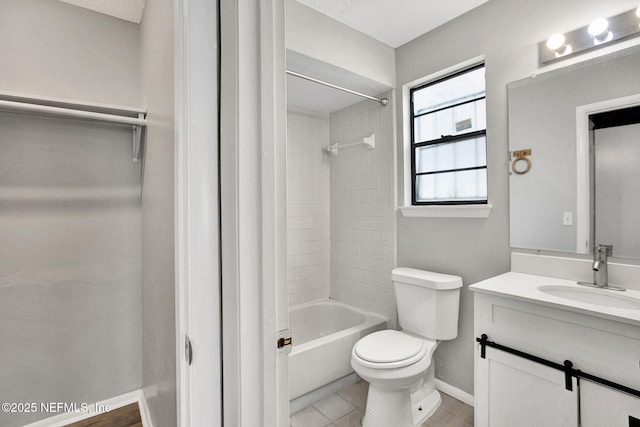 full bathroom featuring baseboards, toilet, tile patterned flooring, bathtub / shower combination, and vanity