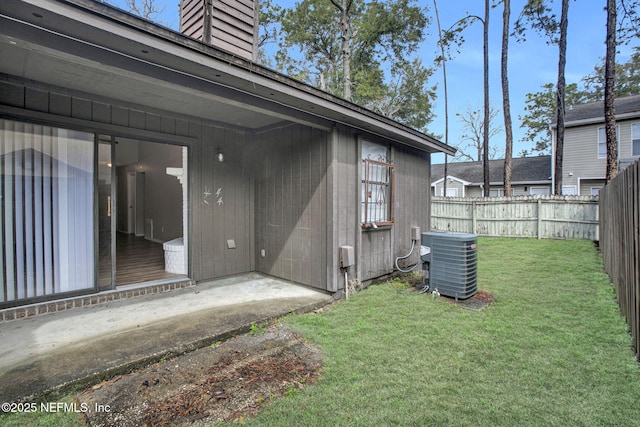 exterior space with fence and central AC unit