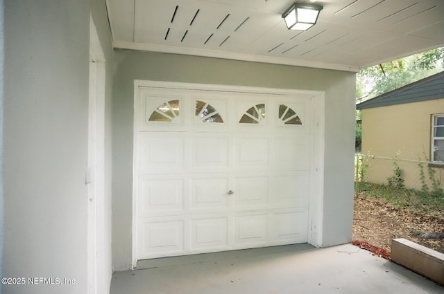 garage featuring fence