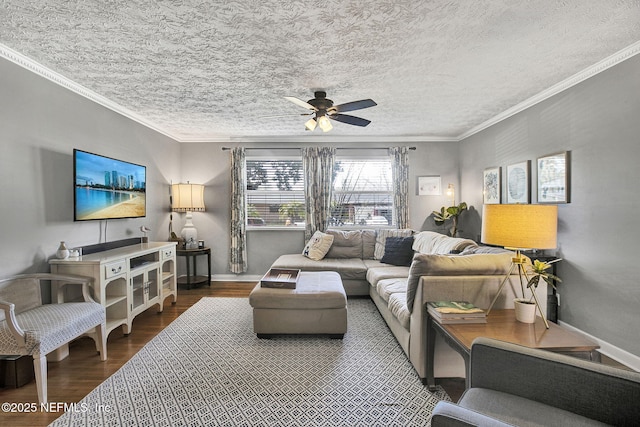 living area with crown molding, a textured ceiling, baseboards, and wood finished floors