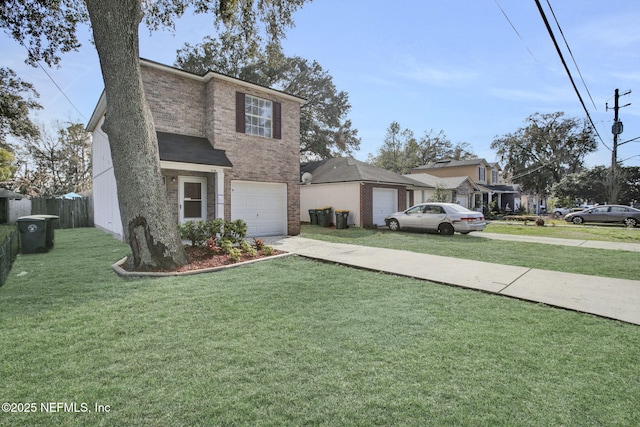 traditional home featuring driveway, an attached garage, fence, a front yard, and brick siding