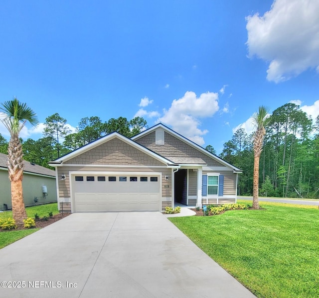 view of front of home featuring a garage, a front lawn, and concrete driveway