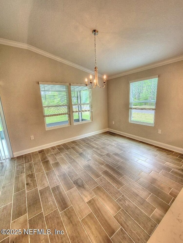 unfurnished room with lofted ceiling, wood finish floors, a chandelier, and crown molding