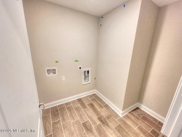 laundry room with wood finish floors, washer hookup, electric dryer hookup, laundry area, and baseboards