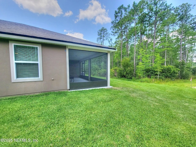 view of yard featuring a sunroom