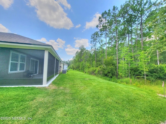 view of yard with a sunroom