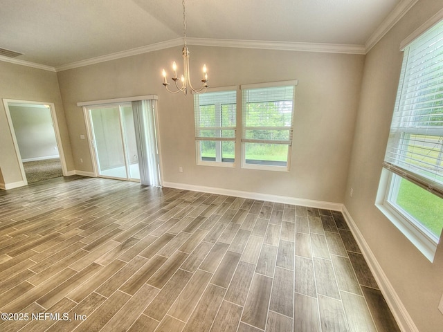 empty room featuring wood tiled floor, visible vents, a chandelier, and a wealth of natural light