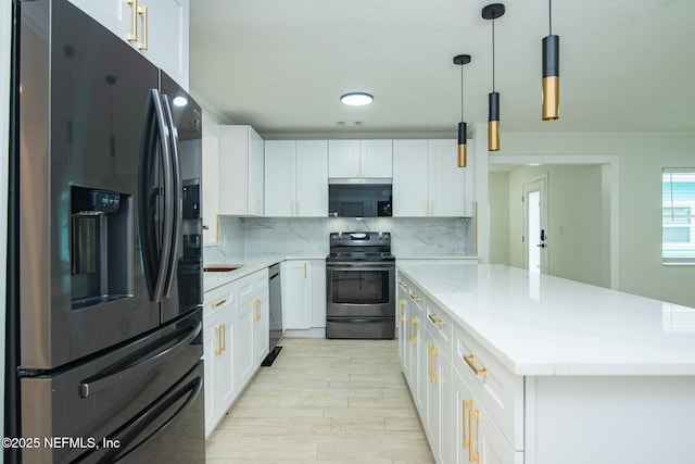 kitchen with stainless steel appliances, backsplash, and white cabinetry