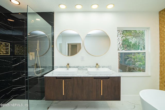 full bathroom with a soaking tub, marble finish floor, a sink, and a marble finish shower