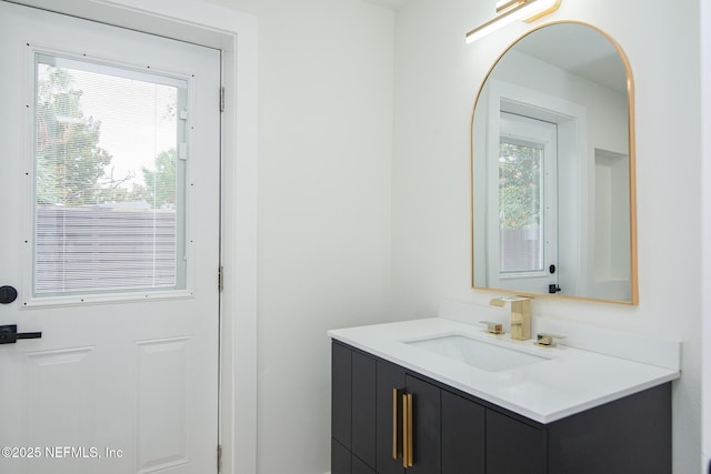 bathroom featuring plenty of natural light and vanity