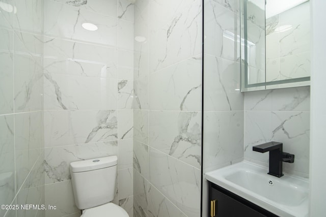 bathroom with toilet and vanity