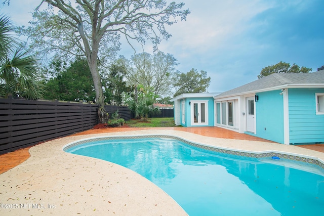 view of pool with a fenced backyard, a fenced in pool, and a patio