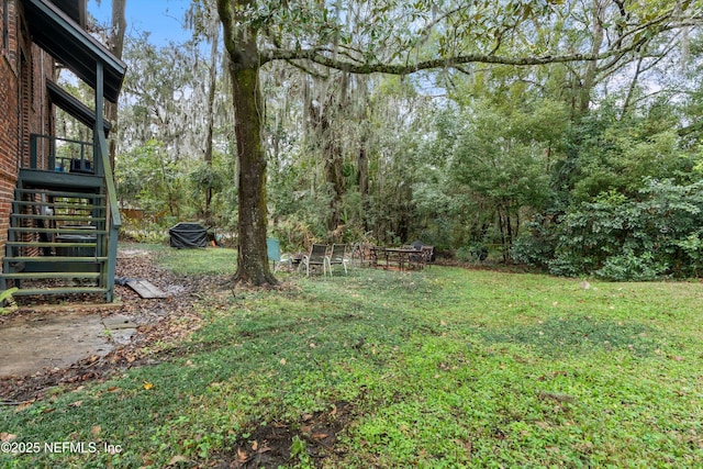 view of yard featuring stairway