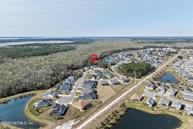 bird's eye view featuring a residential view and a water view