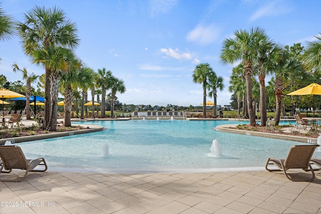 community pool with a patio area