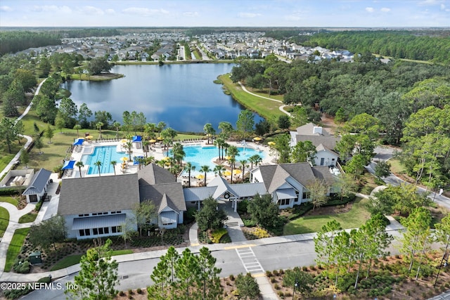 birds eye view of property with a water view