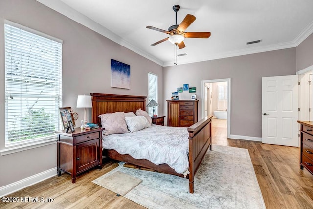 bedroom featuring light wood-style floors, visible vents, crown molding, and baseboards