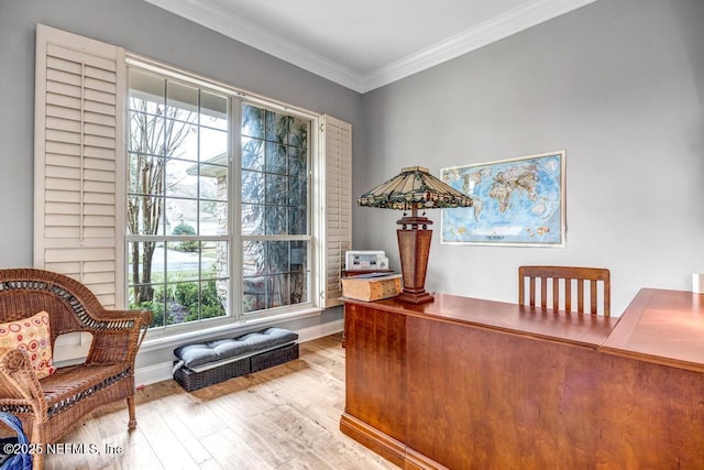 office featuring baseboards, ornamental molding, and wood finished floors