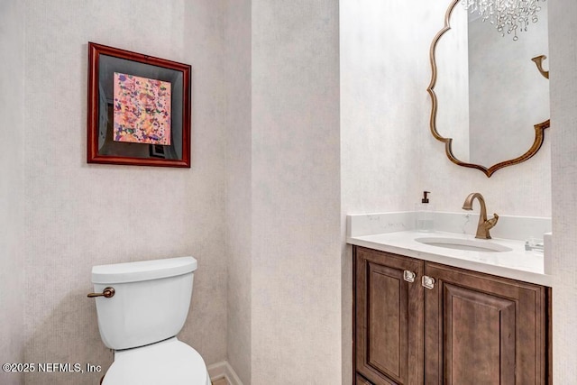 bathroom with toilet and vanity