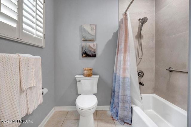 bathroom with toilet, baseboards, shower / bath combo with shower curtain, and tile patterned floors