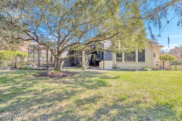 back of property featuring a yard and fence