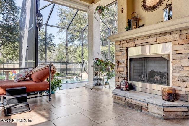 sunroom with a stone fireplace