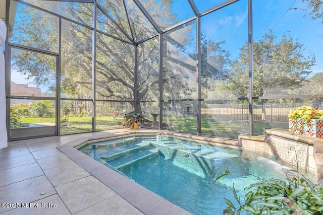 view of pool with a patio area and a lanai