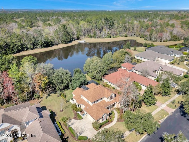 aerial view with a water view, a residential view, and a view of trees