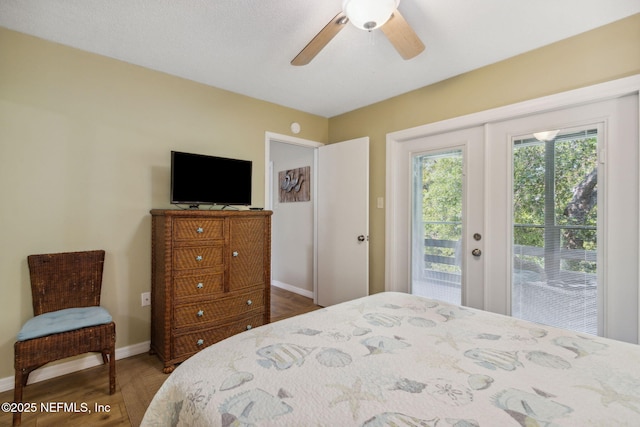 bedroom featuring ceiling fan, access to outside, french doors, and baseboards