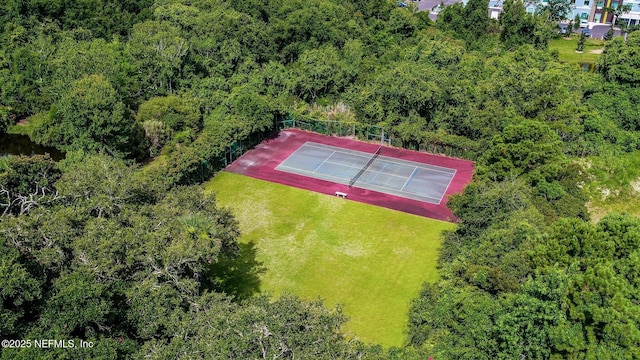 birds eye view of property with a wooded view