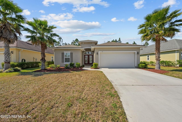 view of front of home featuring driveway, french doors, an attached garage, and stucco siding