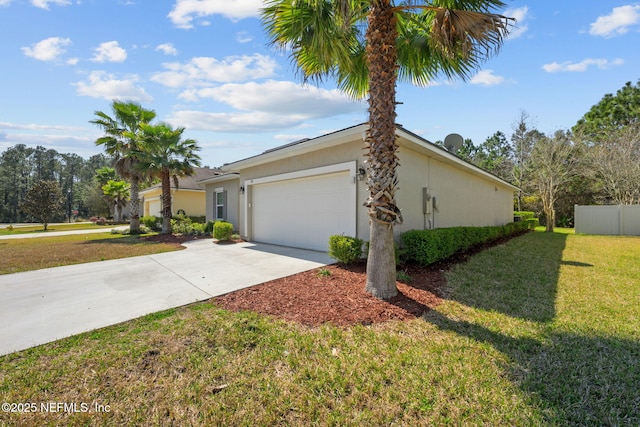 view of front of property featuring concrete driveway, stucco siding, an attached garage, fence, and a front yard