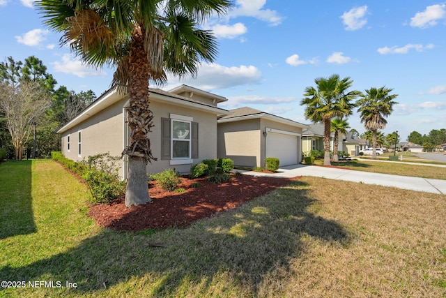 view of front facade featuring concrete driveway, an attached garage, a front lawn, and stucco siding