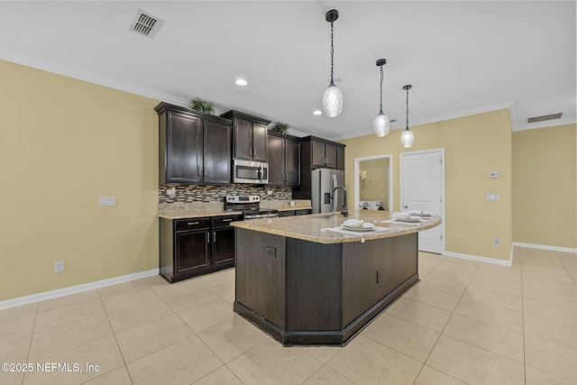 kitchen with light tile patterned floors, visible vents, ornamental molding, appliances with stainless steel finishes, and tasteful backsplash