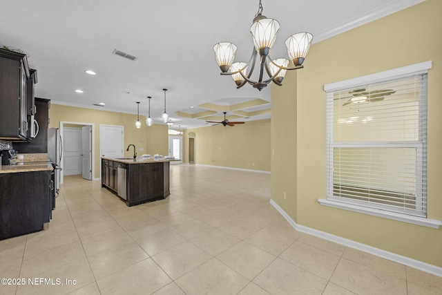 kitchen featuring ceiling fan with notable chandelier, baseboards, open floor plan, dark brown cabinets, and crown molding