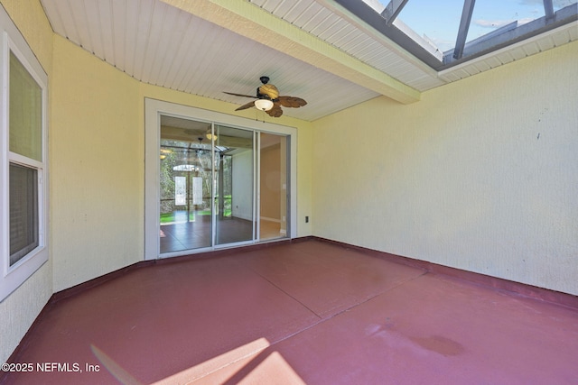 view of patio / terrace with glass enclosure and ceiling fan