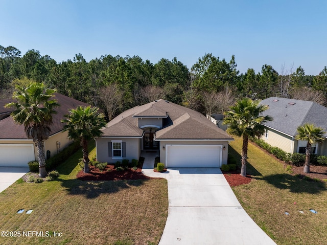 view of front of house with concrete driveway, an attached garage, a front lawn, and stucco siding