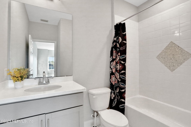 full bathroom featuring visible vents, shower / tub combo, vanity, and toilet