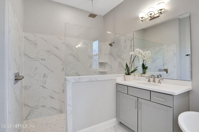 full bathroom featuring marble finish floor, visible vents, vanity, and a marble finish shower