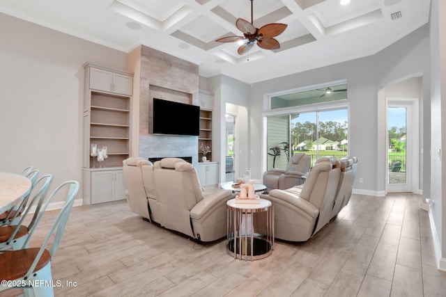 living area featuring baseboards, coffered ceiling, a ceiling fan, light wood-style flooring, and beamed ceiling